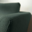 close up view of the contemporary three-seat sofa in moss green to show the polyester fabric