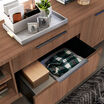 Executive lateral file cabinet shown with bottom drawer open