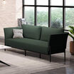 contemporary three-seat sofa in moss geen placed in office setting with windows