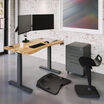 Work fit pro bundle setup in a workspace includes an ergo electric standing desk with dual monitor arm an active mat a file cabinet and active seat